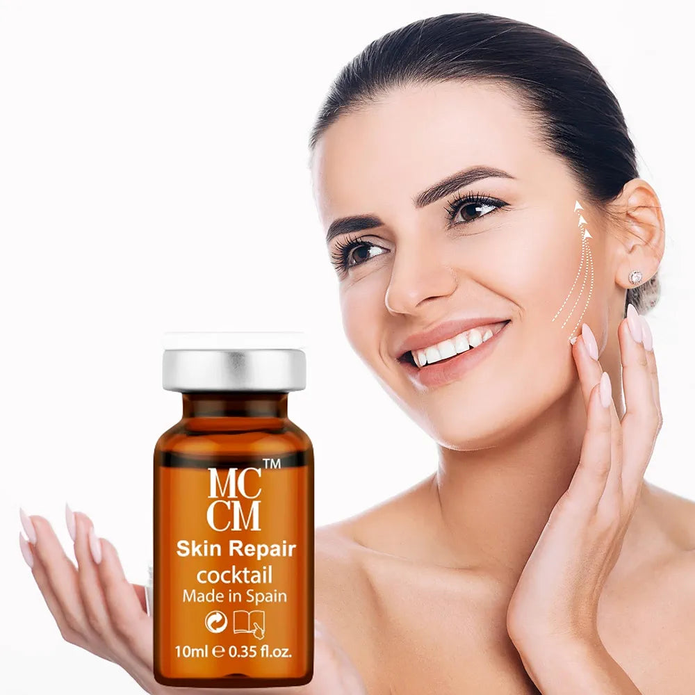 A woman smiling while holding a vial of MCCM SKIN REPAIR COCKTAILS next to her face, illustrating the product's use for skin care.