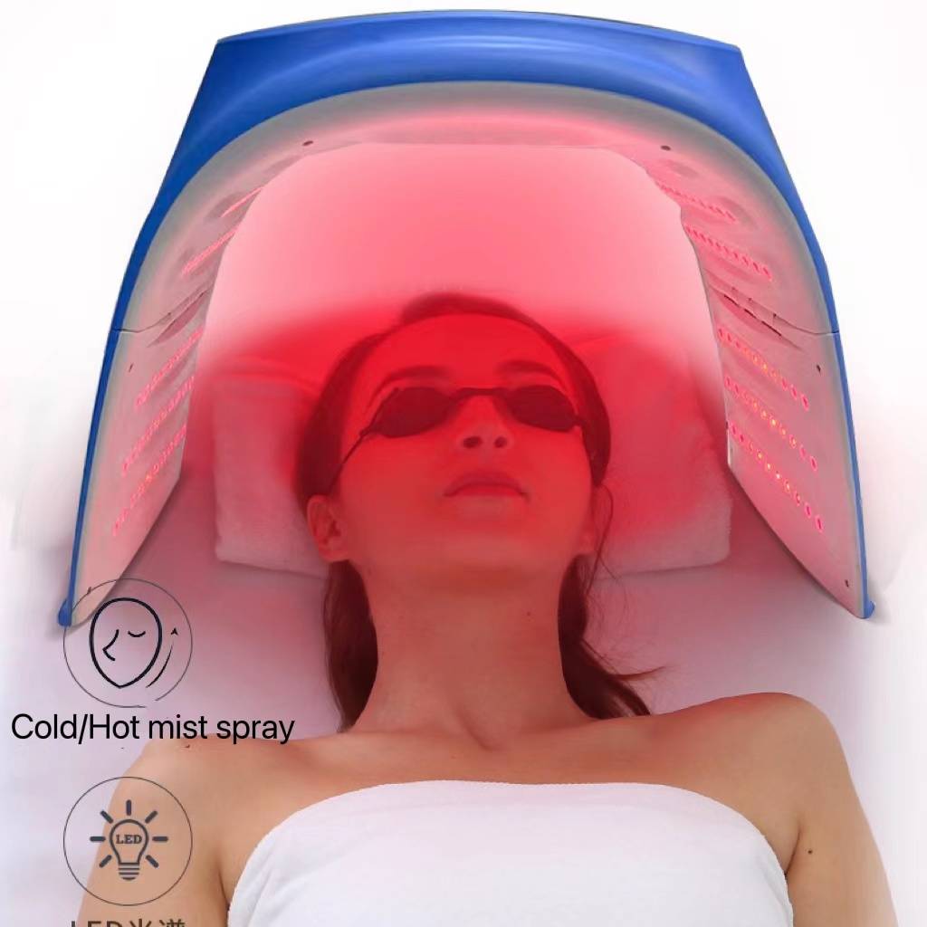 Close-up of a user experiencing skin therapy under the Omega PDT Light featuring warm steam and red LED lights.