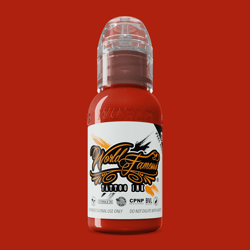 Close-up of WORLD FAMOUS Red Hot 15ml Tattoo Ink bottle emphasizing its high pigment quality and vegan-friendly formulation.