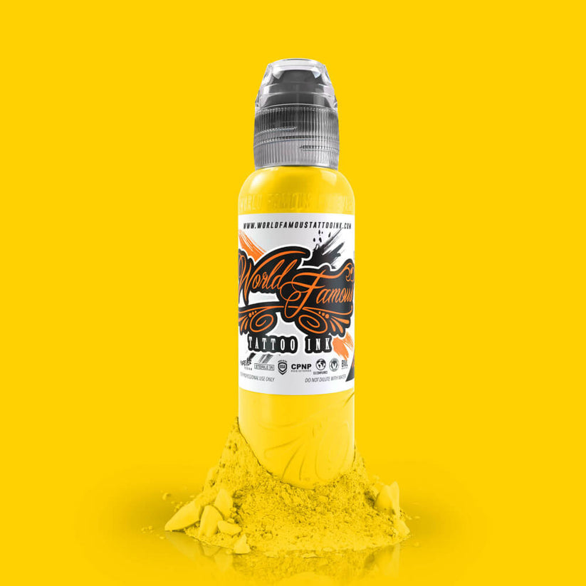 Close-up of WORLD FAMOUS Canary Yellow 15ml Tattoo Ink demonstrating its smooth flow and fast healing properties for stunning tattoo artistry.