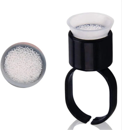 Close-up of Tattoo Ink Ring Cups 10pcs featuring absorbent sponge inserts, ideal for cosmetic tattooing and preventing pigment spills.