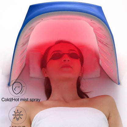 Close-up of a user experiencing skin therapy under the Omega PDT Light featuring warm steam and red LED lights.