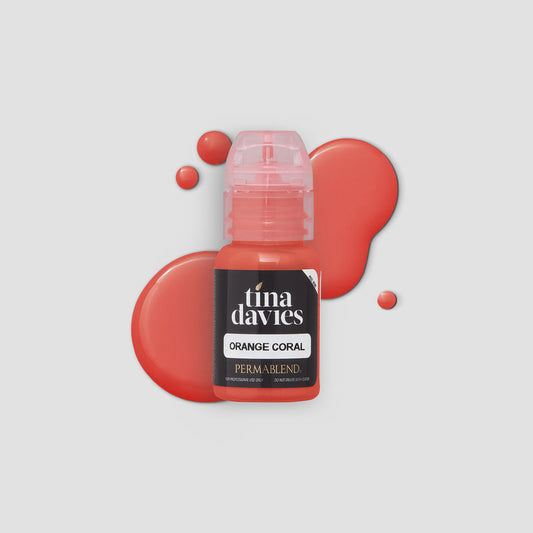 Close-up of Orange Coral - Tina Davies Lust Lip Perma Blend pigment bottle on a vibrant orange background, showcasing its rich coral color.