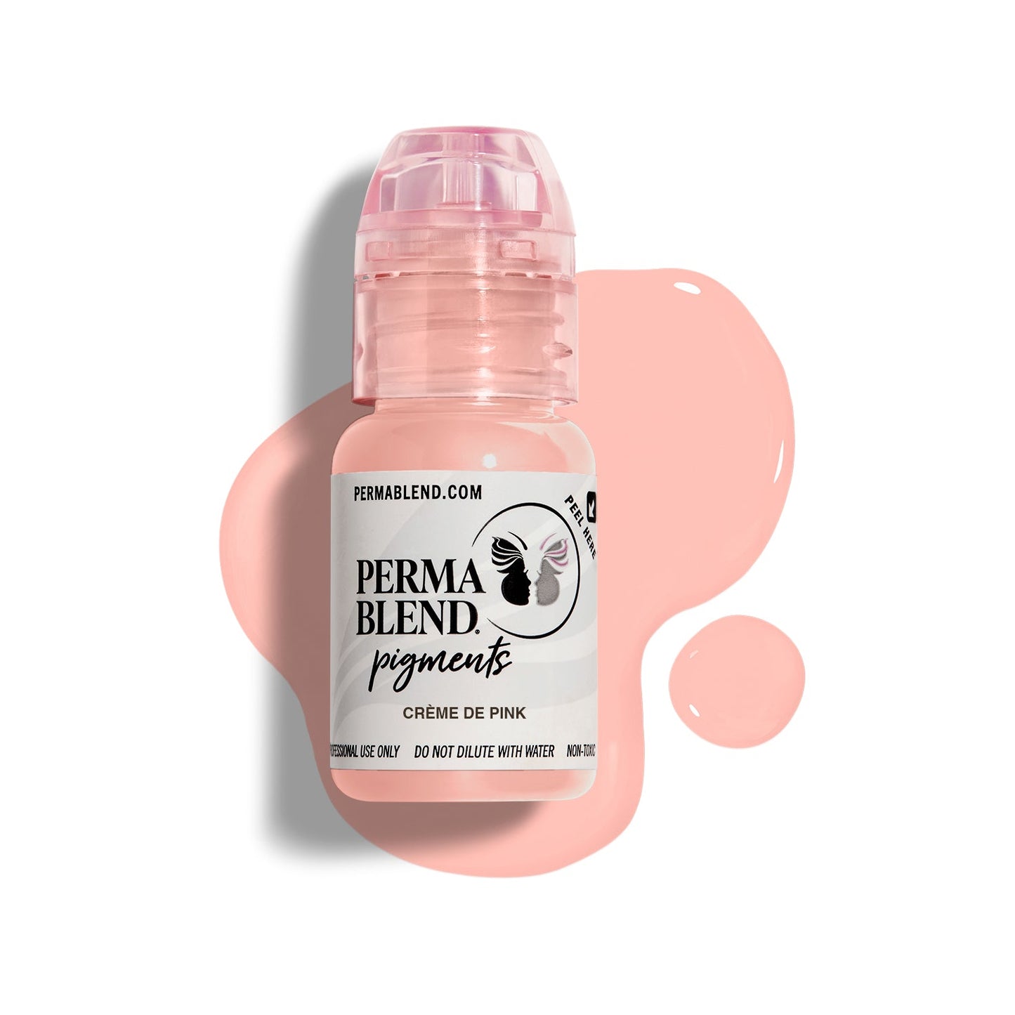 A bottle of Permablend Crème de Pink pigment, showcasing a light pink color with a glossy cap, set against a light backdrop and surrounded by spilled pigment.