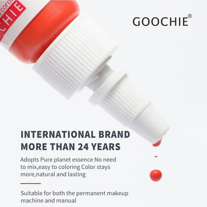 Close-up of GOOCHIE Fuchsine 312 bottle with a droplet of pigment, highlighting its quality for permanent makeup.