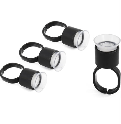 Stack of Tattoo Ink Ring Cups 10pcs, perfect for holding tattoo pigments securely during microblading and eyebrow extensions.