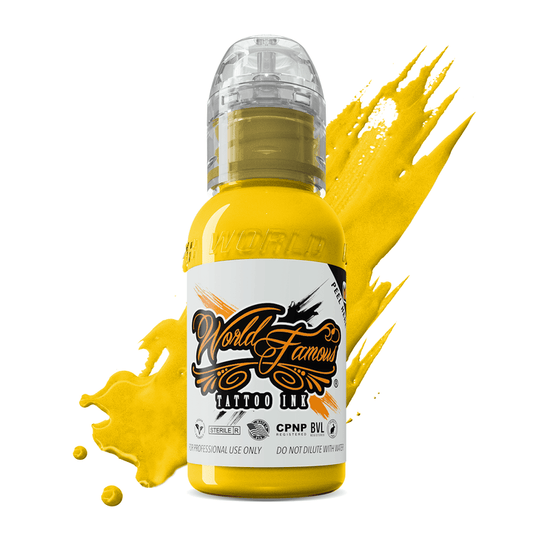 WORLD FAMOUS Canary Yellow 15ml Tattoo Ink bottle showcasing its vibrant color, vegan formulation, and high pigment content for tattoo artists.